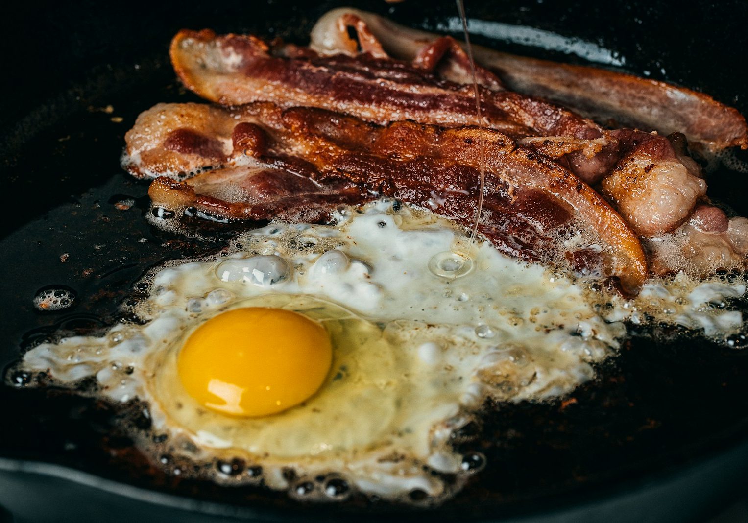 fried egg on black pan